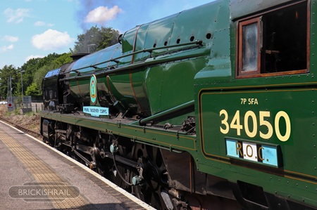34053