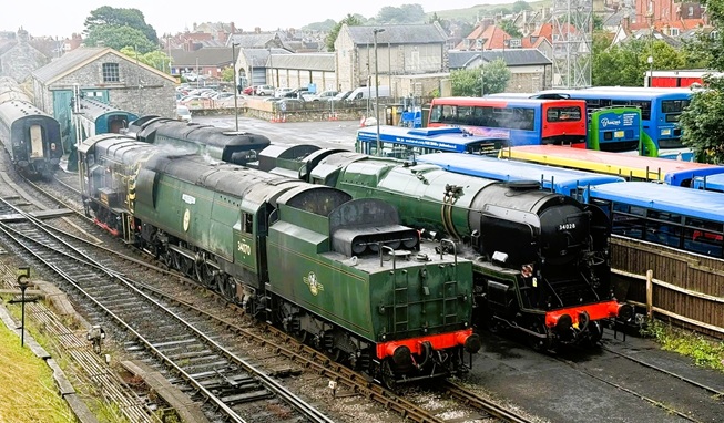 34053