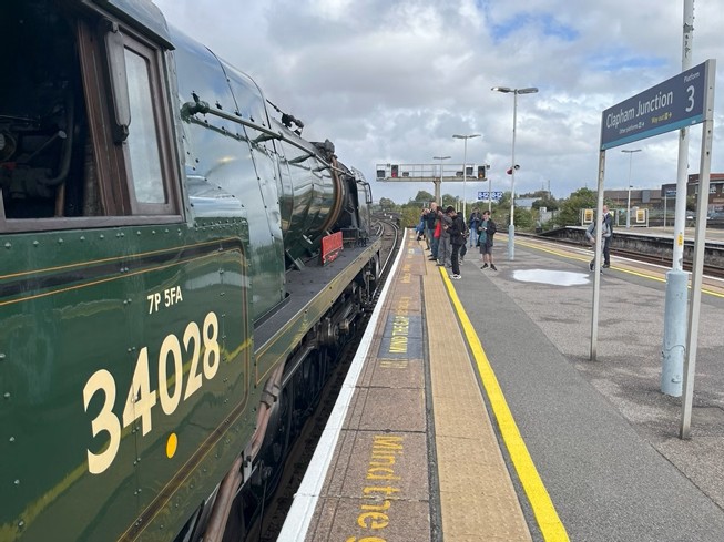 34053